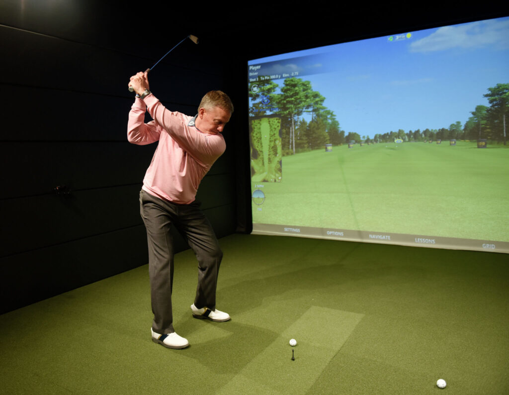 How is a golf simulator different from an actual golf course?